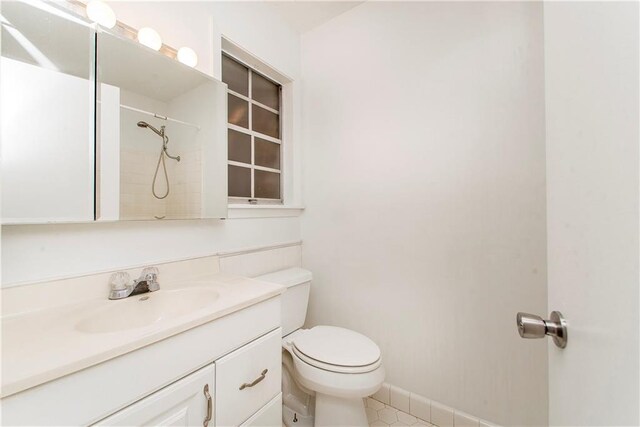 20 Silman Ave, Hammond, LA 70403 - bathroom featuring toilet, vanity, tile patterned floors, and baseboards