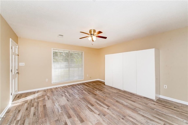 20 Silman Ave, Hammond, LA 70403 - unfurnished bedroom featuring light wood finished floors, baseboards, a closet, and ceiling fan