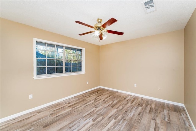 20 Silman Ave, Hammond, LA 70403 - empty room featuring light wood finished floors, ceiling fan, and baseboards
