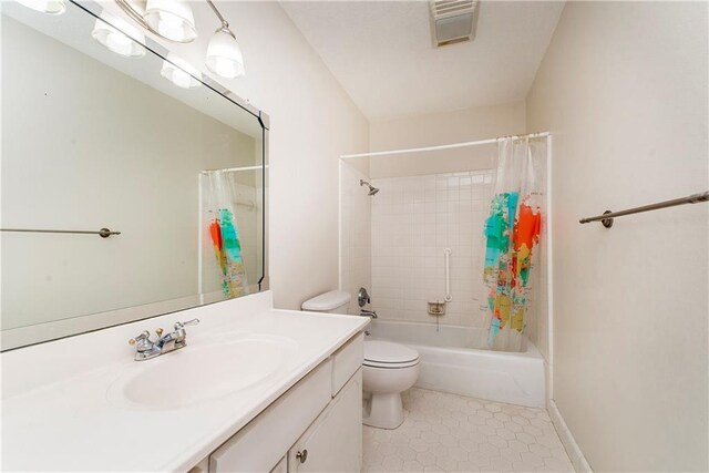 20 Silman Ave, Hammond, LA 70403 - bathroom featuring toilet, tile patterned floors, vanity, and shower / bath combo with shower curtain