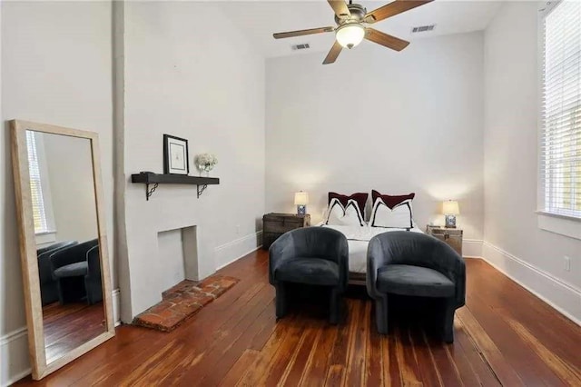 bedroom with hardwood / wood-style floors, vaulted ceiling, and ceiling fan