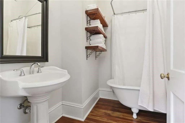 bathroom with hardwood / wood-style flooring