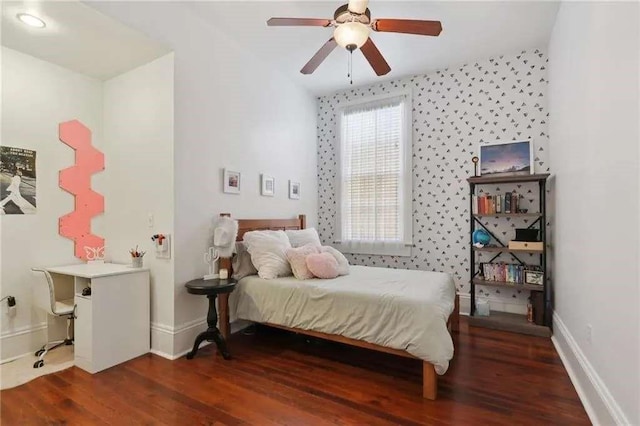 bedroom featuring dark wood-type flooring, ceiling fan, and lofted ceiling