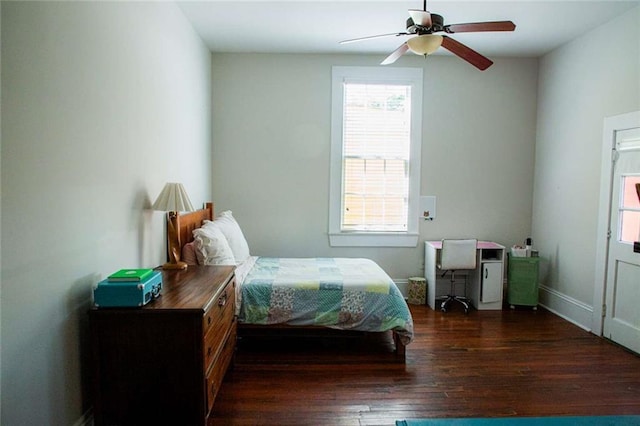 bedroom featuring ceiling fan and dark hardwood / wood-style flooring