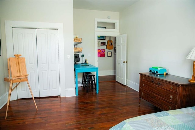 bedroom featuring a closet and dark hardwood / wood-style floors