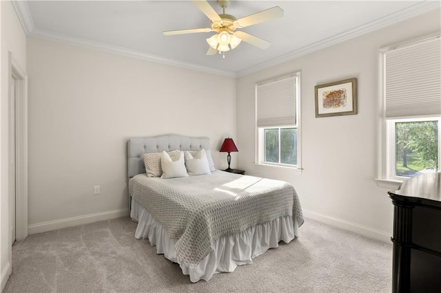 bedroom with multiple windows, light colored carpet, and ceiling fan