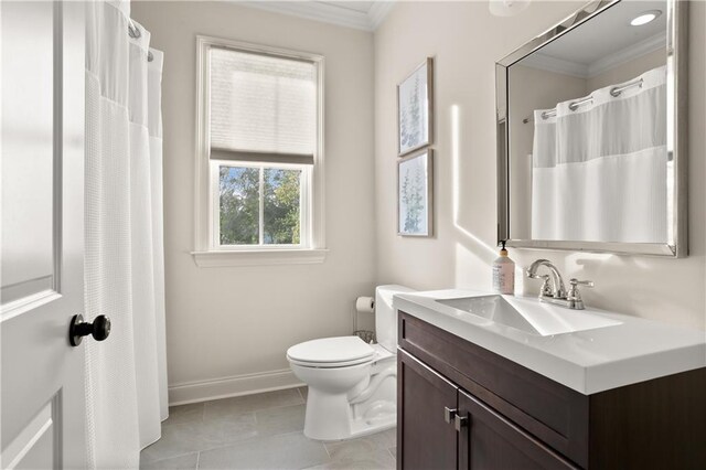 bathroom with vanity, ornamental molding, toilet, and tile patterned floors