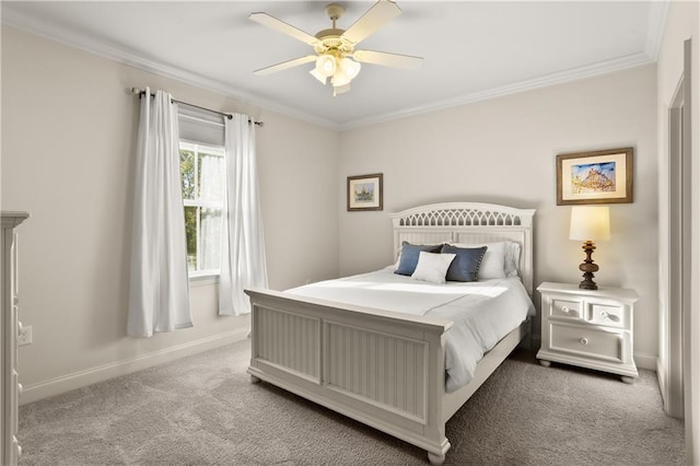 carpeted bedroom with ornamental molding and ceiling fan