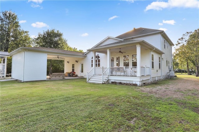 rear view of property featuring a patio, a yard, and ceiling fan