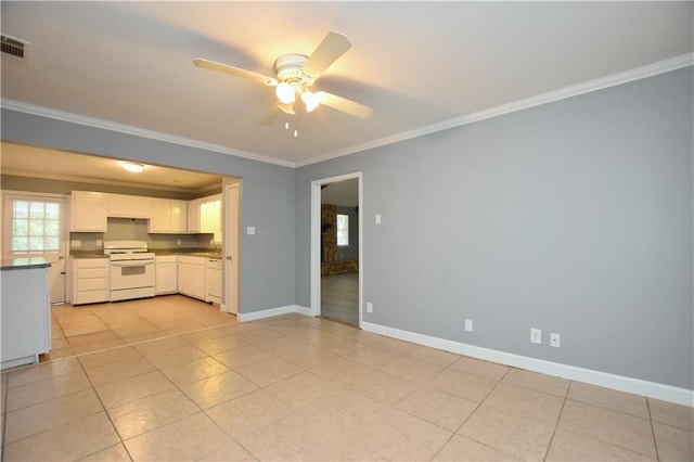 unfurnished living room featuring ceiling fan, sink, light tile patterned floors, and ornamental molding