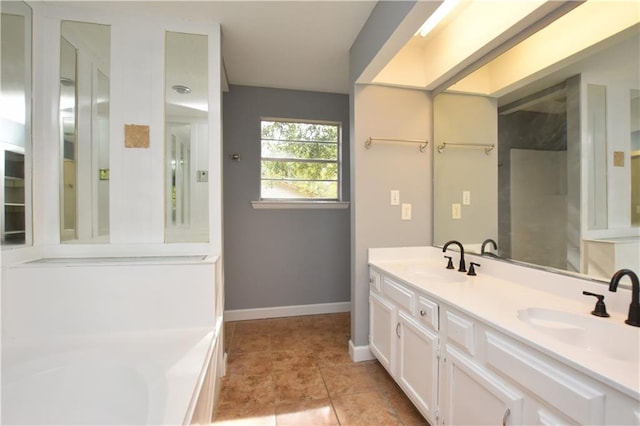 bathroom featuring tile patterned flooring and vanity