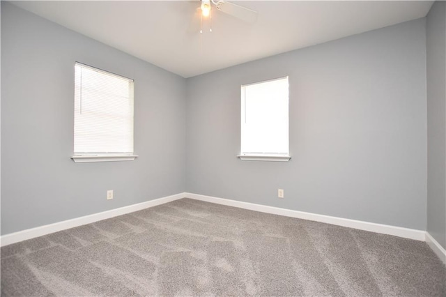 empty room with carpet and ceiling fan