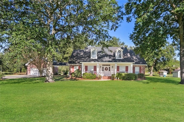 view of front facade featuring a front lawn and covered porch