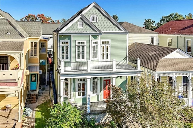 rear view of house featuring a balcony