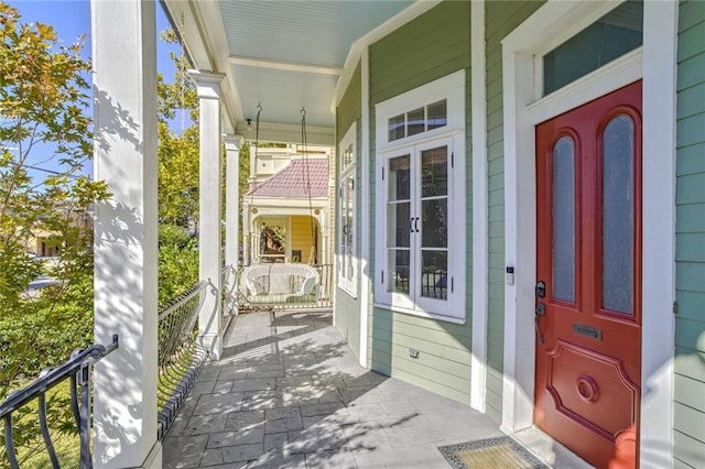 property entrance featuring covered porch