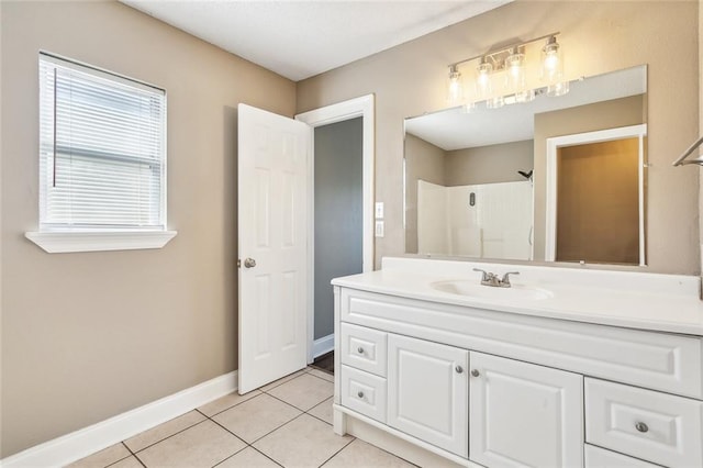 bathroom featuring vanity, walk in shower, and tile patterned floors