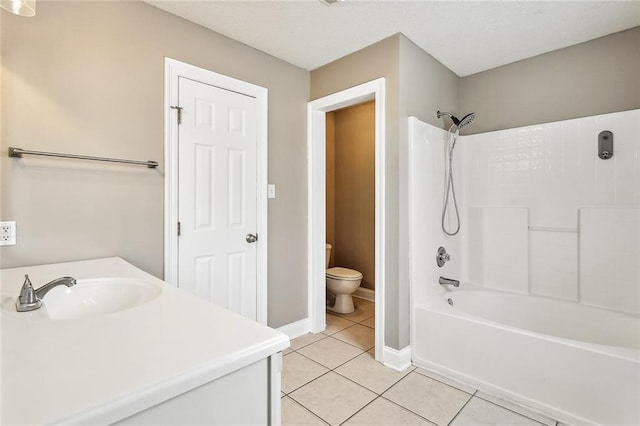 full bathroom featuring toilet, vanity,  shower combination, and tile patterned flooring