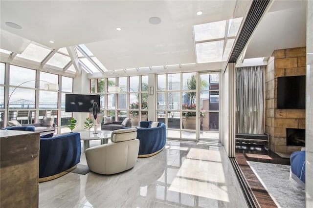 living room with a tile fireplace