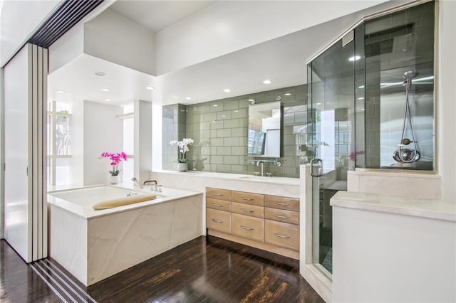 620 Decatur St Unit Phb3, New Orleans, LA 70130 - full bathroom featuring a stall shower, wood finished floors, and vanity
