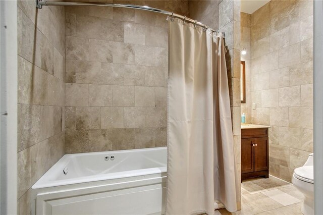 620 Decatur St Unit Phb3, New Orleans, LA 70130 - full bathroom with shower / tub combo with curtain, toilet, tile walls, tile patterned floors, and vanity