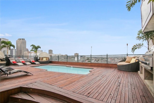 view of pool with a wooden deck