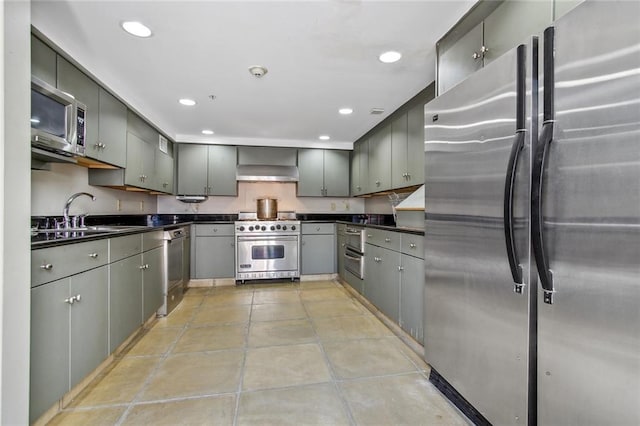 kitchen featuring gray cabinets, sink, light tile patterned flooring, and stainless steel appliances