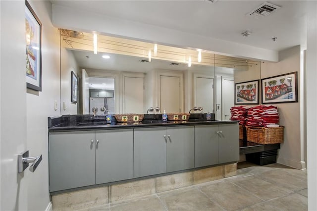 kitchen with gray cabinets and beamed ceiling