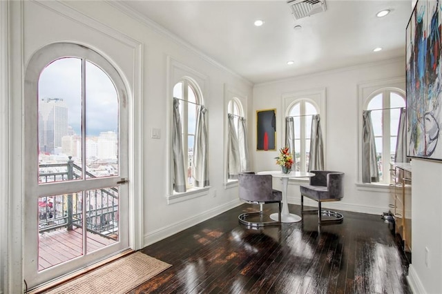 620 Decatur St Unit Phb3, New Orleans, LA 70130 - entrance foyer with ornamental molding, visible vents, dark wood-style flooring, and baseboards