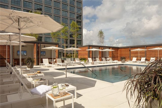 view of swimming pool featuring a patio area