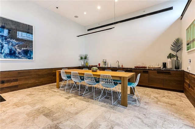 1001 Julia St Unit 2A, New Orleans, LA 70113 - dining space featuring stone finish floors, bar, and recessed lighting