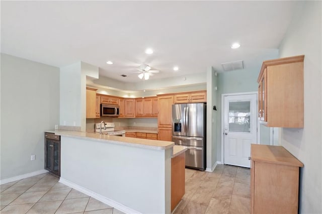 kitchen with kitchen peninsula, wine cooler, ceiling fan, appliances with stainless steel finishes, and light brown cabinetry