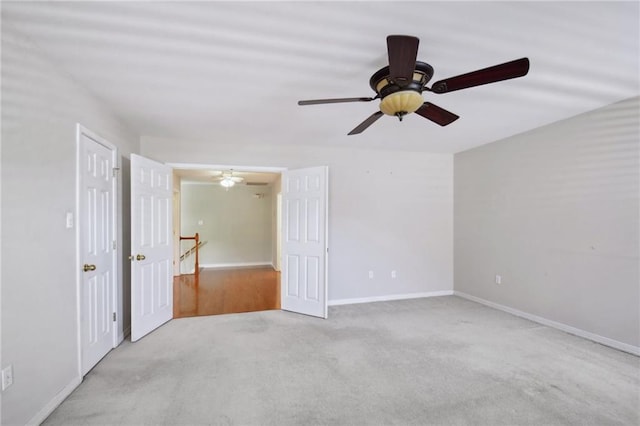 unfurnished room featuring light colored carpet