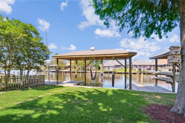 view of dock featuring a water view and a lawn