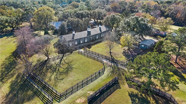 birds eye view of property with a rural view