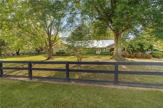 view of gate featuring a yard