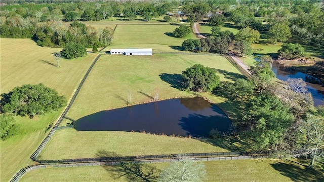 drone / aerial view featuring a rural view and a water view