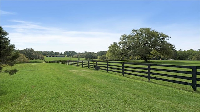 view of yard with a rural view