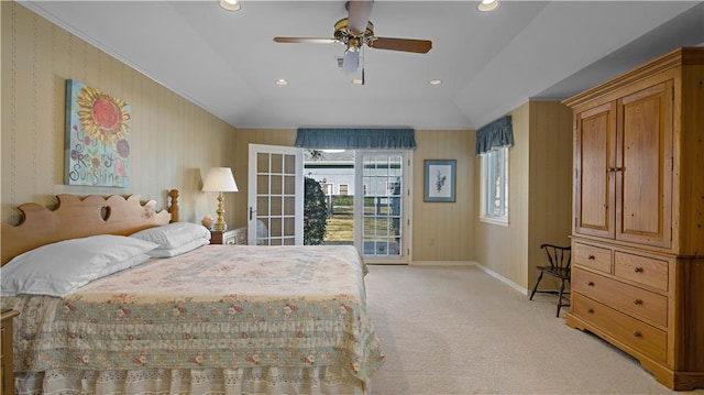 carpeted bedroom with ceiling fan, vaulted ceiling, and access to exterior