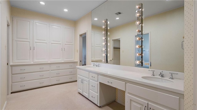 full bathroom featuring visible vents, a sink, double vanity, and recessed lighting
