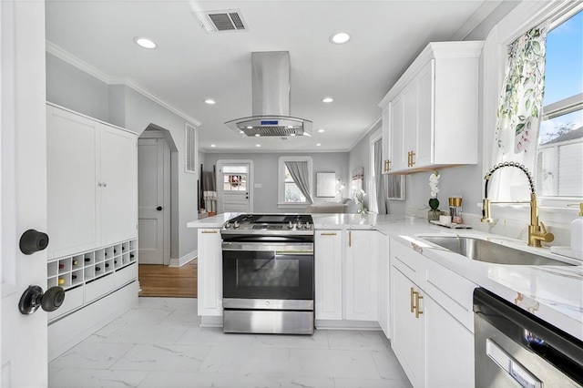 kitchen featuring kitchen peninsula, island exhaust hood, stainless steel appliances, and sink