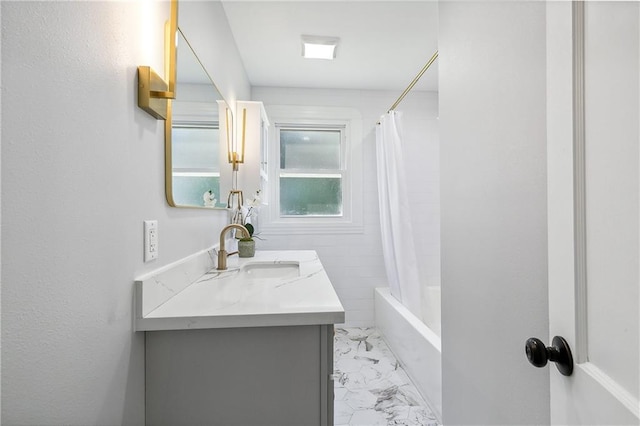 bathroom featuring vanity and shower / tub combo