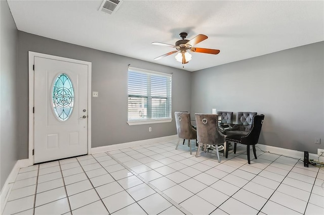 interior space featuring ceiling fan