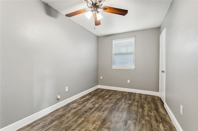 spare room featuring ceiling fan and dark hardwood / wood-style floors