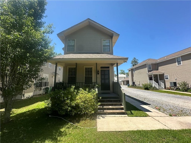 view of front of property featuring a porch and a front lawn