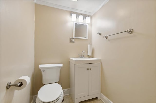 bathroom with toilet, crown molding, vanity, and tile patterned flooring