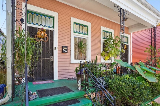 doorway to property with a porch