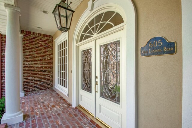 doorway to property featuring covered porch