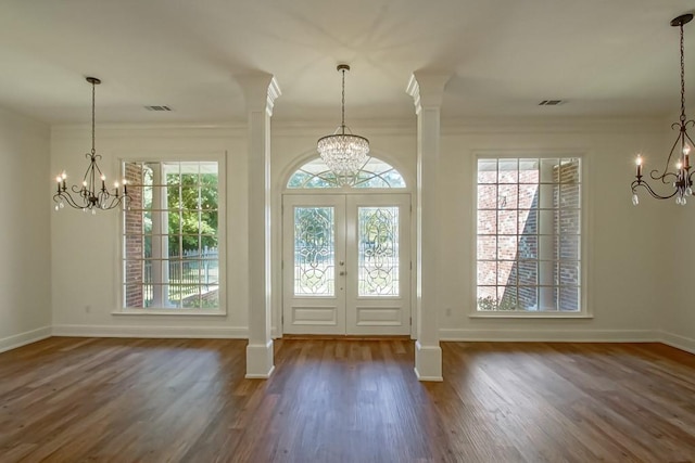 interior space featuring a chandelier and baseboards