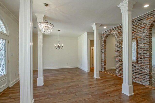 unfurnished living room featuring crown molding, a fireplace, and ceiling fan