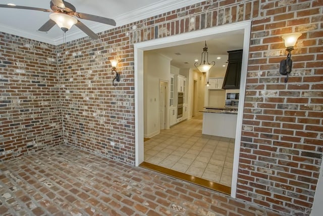interior space featuring crown molding and ceiling fan